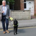 Jeremy Fletcher and guide dog Quest