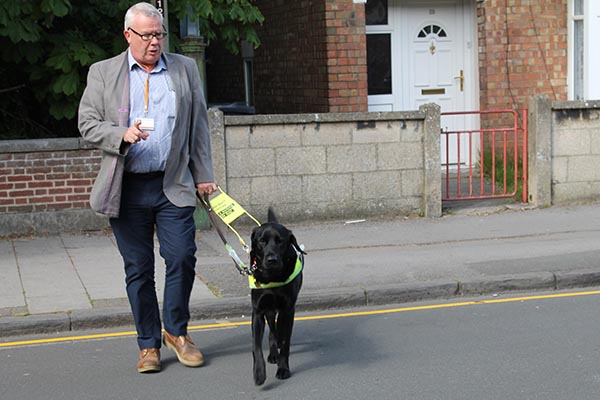 Jeremy Fletcher and guide dog Quest