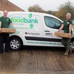 Adam (Volunteer), Chris Offord (Deputy Manager), Cher Smith (Manager) and Steve (Volunteer) with Foodbank boxes