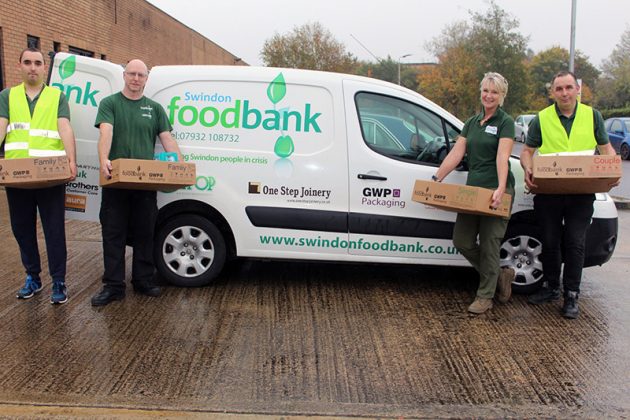 Adam (Volunteer), Chris Offord (Deputy Manager), Cher Smith (Manager) and Steve (Volunteer) with Foodbank boxes