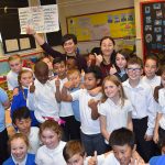 year-5-at-gorse-hill-primary-school-give-thumbs-up-for-shanghai-maths-lesson-with-teachers-jinjin-left-and-zhang-right-resized