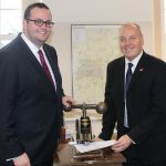 Cllr Toby Elliott, Swindon Borough Council’s Cabinet Member for Strategic Planning and Sustainability (left) with Swindon Borough Council’s Chief Executive John Gilbert using the Council’s embossing machine to affix the Council’s seal to the Wichelstowe Joint Venture documentation.