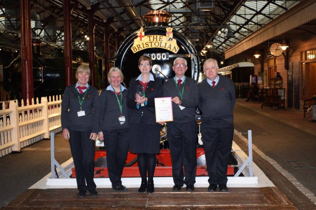 STEAM's front of house team holding the award in front of King George V