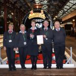 STEAM's front of house team holding the award in front of King George V