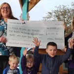 Gina Dawkins presents the cheque to Tina Azzopardi, with Jules, Imogen and Thomas - cropped
