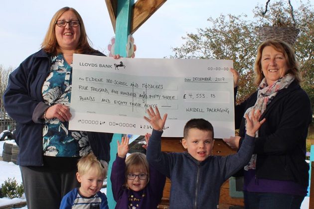 Gina Dawkins presents the cheque to Tina Azzopardi, with Jules, Imogen and Thomas - cropped