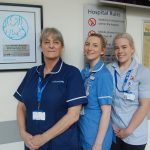 Cathy Gale, Lucia Szweda, Midwife, and Kirsty Wheeler, Student Midwife, in front of the new plaque in GWH's Atrium reception.