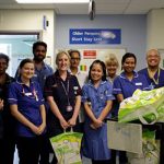 Chief Nurse, Julie Marshman and Matron Gastroenterology and Respiratory, Kevin Jenner handing out goodie bags to nurses on the ward