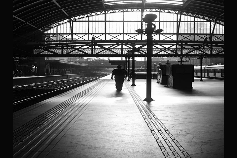 man waiting to commute via train