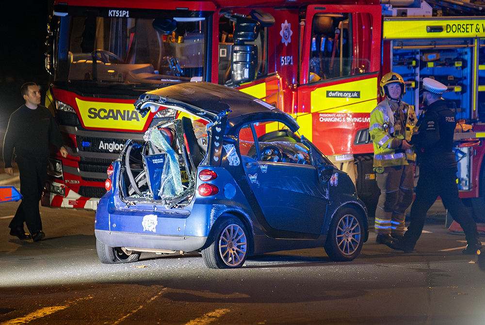 Crash at Bruce Street Bridges sees woman trapped in flipped car