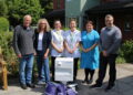 Hospice receives interactive table from parish council