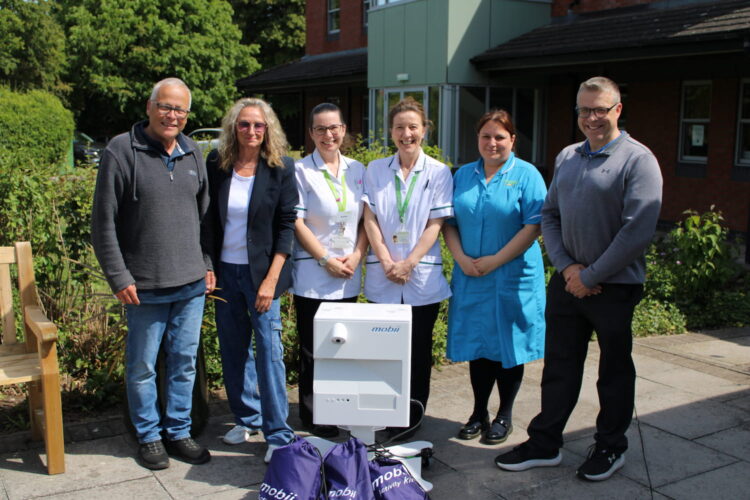 Hospice receives interactive table from parish council