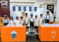 Young entrepreneurs sell sweets in town centre pop-up
