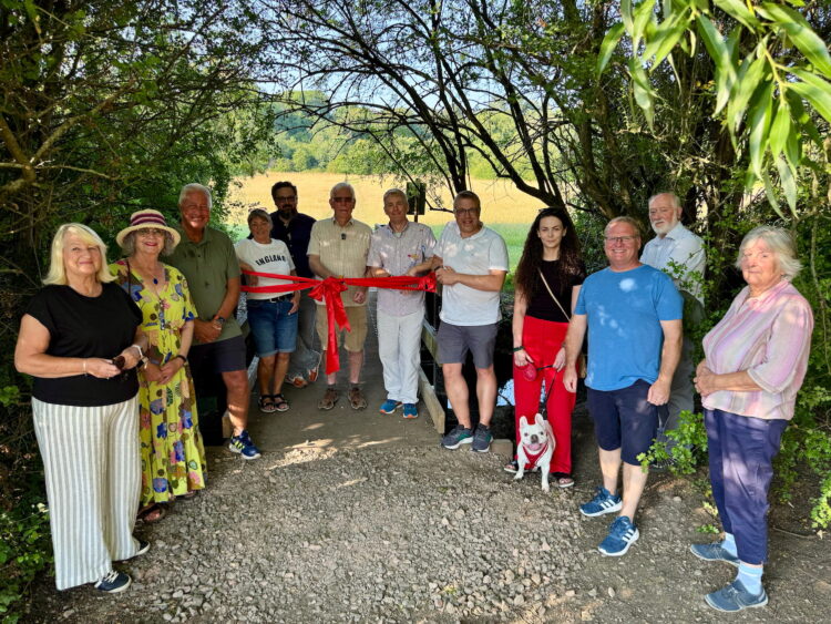 Burned down, rebuilt by volunteers, refurbished, now officially reopened: The remarkable story of Seven Fields’ King Bridge