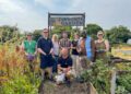 Councillors get hands dirty helping Ukrainian community garden flourish