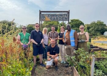 Councillors get hands dirty helping Ukrainian community garden flourish