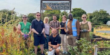 Councillors get hands dirty helping Ukrainian community garden flourish
